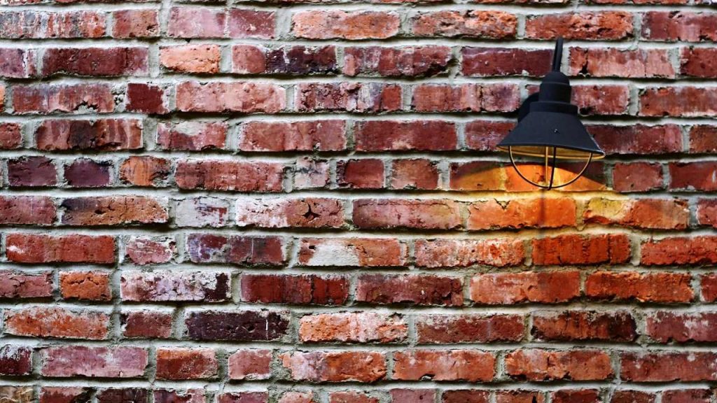 how to hang festoon lights on brick wall